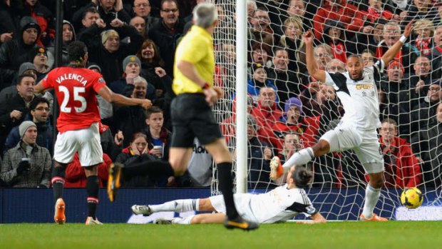 Pressure released: Antonio Valencia opens the scoring for Manchester United against Swansea.