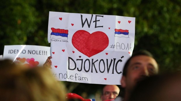 Fans celebrate Novac Djokovic's win over Andy Murray in the men's singles final of the 2016 Australian Open at Melbourne Park.  