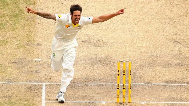 Soar like a bird ... Mitchell Johnson after removing Alastair Cook for a second time this match.