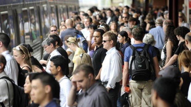 Commuters on the platform at Flinders Street Station .