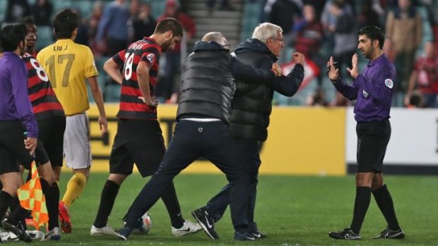 Chaos reigns: Marcello Lippi approaches the referee after his Guangzhou Evergrande side had two late red cards in the 1-0 Asian Champions League loss to Western Sydney.