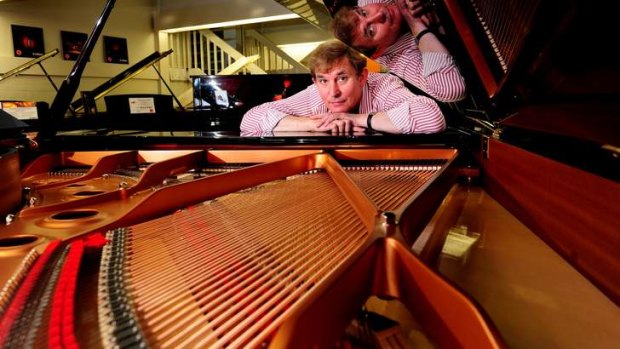 TUNED IN: Tony Magee, manager of DW Music's piano showroom in Fyshwick, says that their acoustic pianos still outsell the digital.