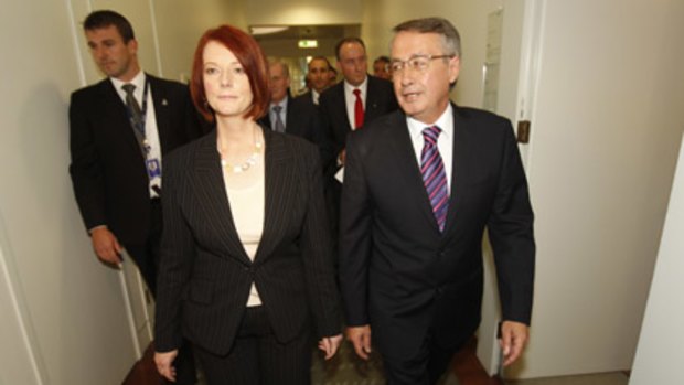 New Prime Minister Julia Gillard and her deputy, Wayne Swan, walk the corridors of Canberra.