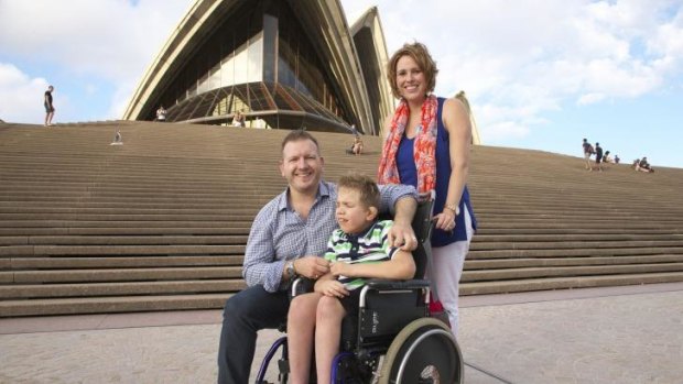 "Not ideal": Accessing the Sydney Opera House can be a long-winded process, says president of the Association for Children with a Disability, Timothy Smith, left, with son Marcus, 8, and wife Caroline.