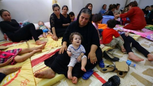 Iraqi Christian families who fled from the northern city of Mosul and nearby towns in the Kurdish-held city of Erbil.