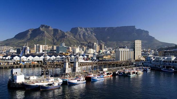 Imposing ... Table Mountain looms over downtown Cape Town.