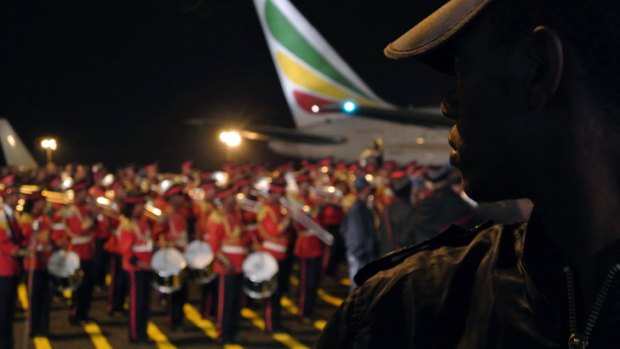 A military marching band awaits the body of Ethiopian Prime Minister Meles Zenawi at Bole International Airport in Addis Ababa.