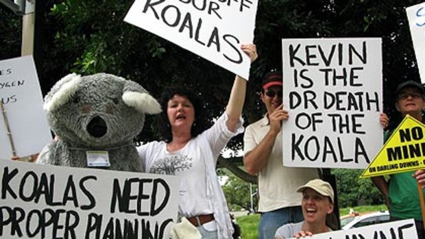 More than 50 protesters, including Paulette Oldfield of the Australian Koala Foundation (centre), chanted outside the Queensland State Library, where Premier Anna Bligh addressed a growth management summit today.