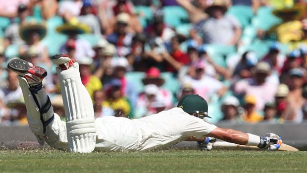 Left for dead ... Michael Hussey, batting in his final Test, fell victim to a direct hit from Dimuth Karunaratne during a second day marked by two disastrous run-outs from the hosts.
