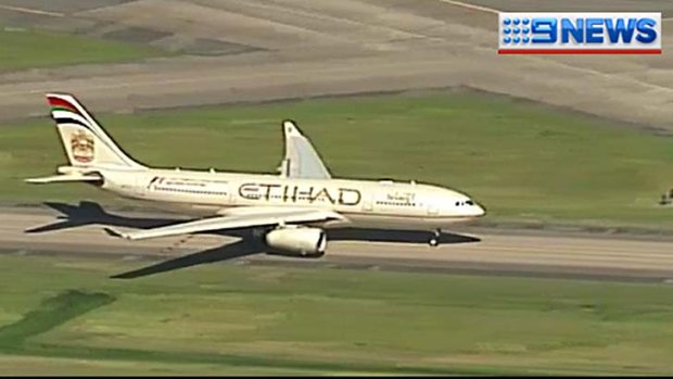 The plane makes an emergency landing at Brisbane Airport.