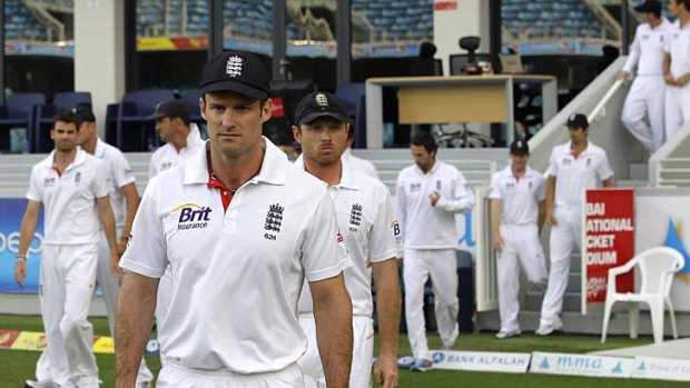 Outplayed: England captain Andrew Strauss leads his defeated team out to the presentations after their 3-0 series loss to Pakistan in Dubai.
