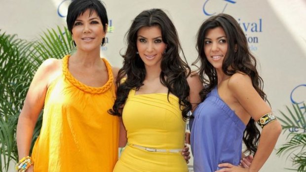 A different kind of show: Kris Jenner with daughters Kim and Kourtney Kardashian. 