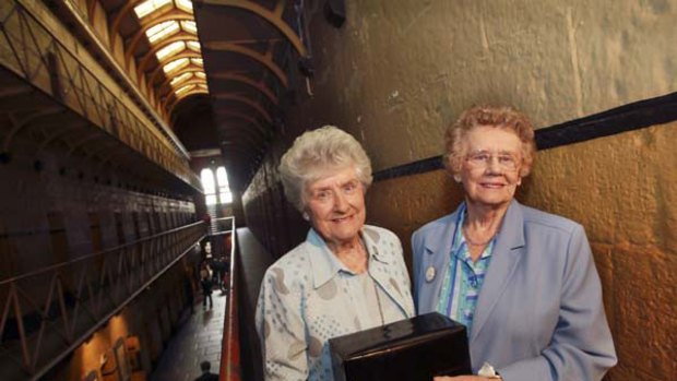 Betty Everett and Pat Spencer, nieces of Colin Campbell Ross with his remains at Old Melbourne Gaol yesterday.
