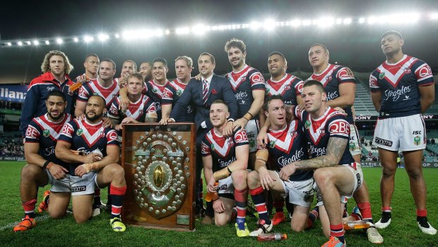 Three in a row: The Roosters pose with the J.J. Giltinan Shield.