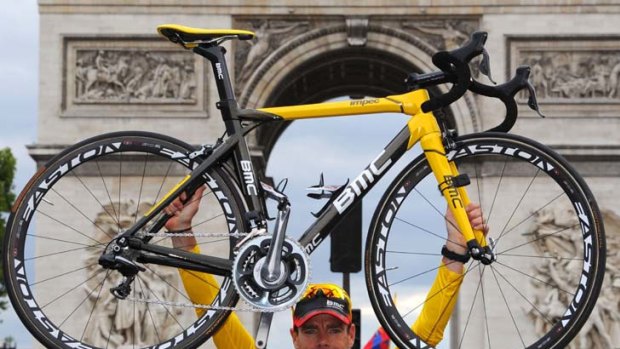 Raising expectations  ...  Cadel Evans celebrates his Tour de France victory in front of the Arc de Triomphe.