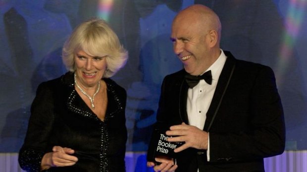 Richard Flanagan accepting the Man Booker literature prize from Camilla, Duchess of Cornwall.