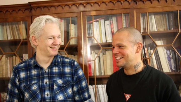 This June 12, 2013 photo released by Calle 13 shows Rene Perez Joglar, better known as, Residente, from the Latin music group Calle 13, right, and WikiLeaks founder Julian Assange during a songwriting session at the Ecuadorian embassy in London.