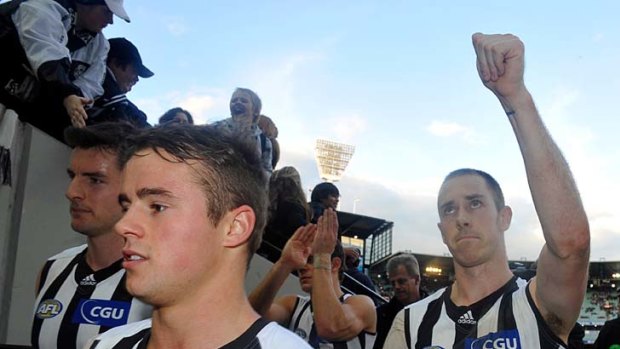 Big week: Magpies skipper Nick Maxwell salutes fans after yesterday's dour win at the MCG.