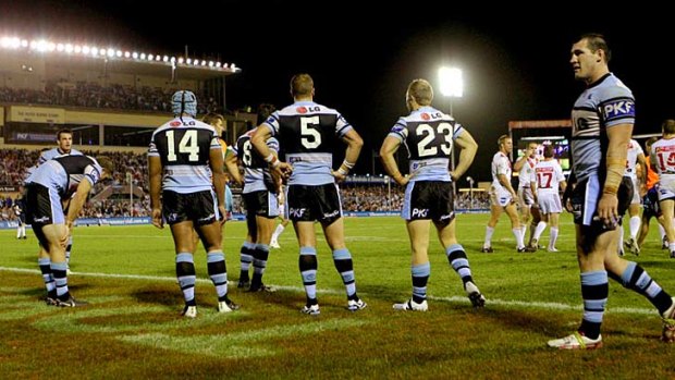 Troubled times for Cronulla: Picture shows the club playing the Dragons. It is unknown which players are caught up in the drug scandal.