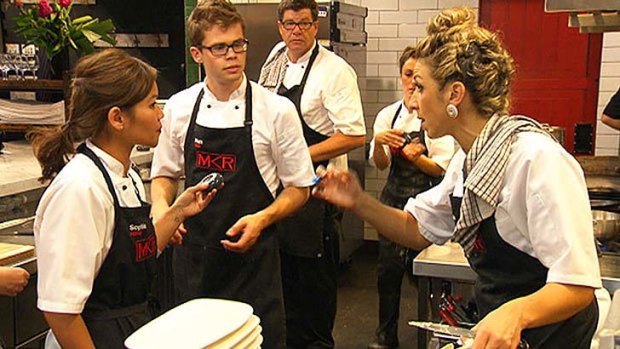 Face-off: The teams come to blows in the kitchen.