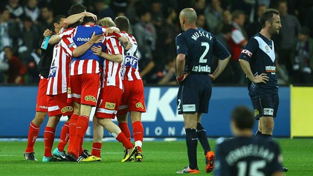 Melbourne Heart players celebrate after winning the round nine match against Melbourne Victory last year.