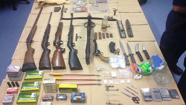Weapons, drugs and drug utensils found at two Normanton properties during police searches.