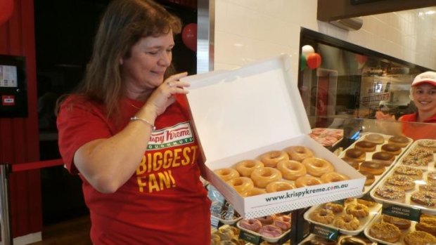 People queued for days to score free doughnuts at the first store opening.