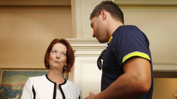 Prime Minister Julia Gillard and Michael Clarke swap tales on Tuesday.