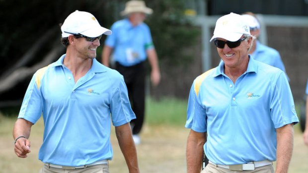 Greg Norman (right) has backed golf's rule change on anchored putting, the style of fellow Australian Adam Scott.
