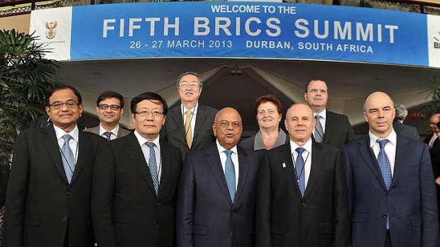 BRICS summit ... South African Finance Minister Pravin Gordhan (centre) poses with his counterparts (left to right) Minister Chidambaram Palaniappan of India, Minister Xiaochuan Zhou of China, Minister Guido Mantega of Brazil and Minister Anto Siluanov of Russia.