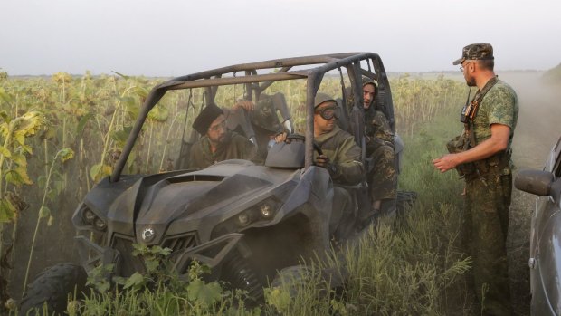 Pro-Russian rebels meet in a field near the village of Khryaschevatoye, in eastern Ukraine.