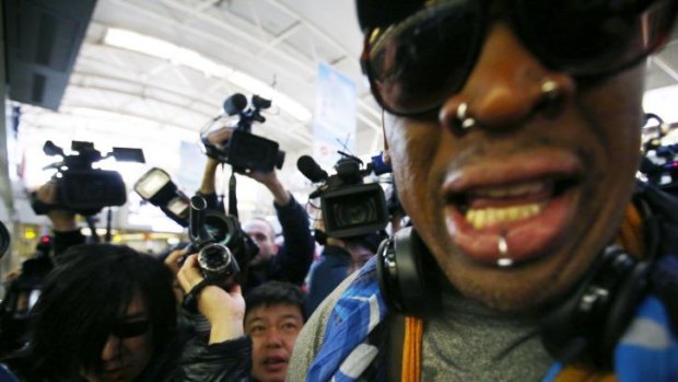 Flying north: Former basketball star Dennis Rodman about to travel from Beijing Airport to Pyongyang on Thursday.