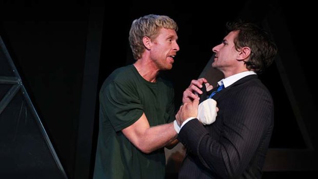 Phil Walker, played by Simon Lyndon, is visited by his lawyer, played by Damian de Montemas, in the play <em>Anaconda</em>.