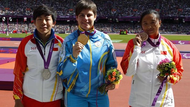 Wrong medals: Ukraine's Mariia Pomazan (centre) with the gold medal after she was judged to have won the women's discus throw-F35/36. China's Wu Qing (left) took silver and Bao Jiongyu won the bronze after the event on August 31. But following protests, the awarding of medals has turned into a farce.