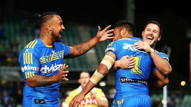 French connection: Bevan French Eels celebrates one of his three tries with teammates during the round 25 NRL match between the Parramatta Eels and the St George Illawarra Dragons.