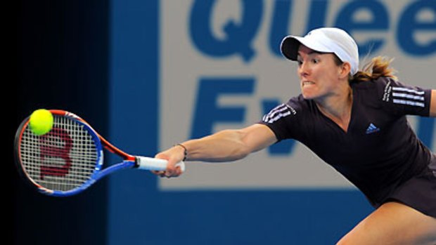 One-hand wonder...Justine Henin hits one of her classic backhands in her tough three-set match against Hungarian Melinda Czink in the Brisbane International yesterday. The Belgian is a making a solid start to her comeback.