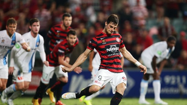 Man in the middle: Tom Juric is in Europe with the Socceroos despite being injured.