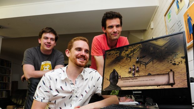 Peter Castle, centre, with fellow creators from left, Peter Simpson and Tom Cox, have developed their game "Tahira" while working in other jobs. 