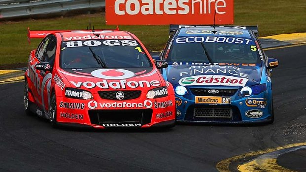 Mark Winterbottom (Ford) does battle with Jamie Whincup (Holden) in the Sandown 500 but Whincup only has to start at Winton to wrap up the title.
