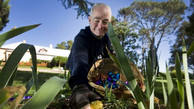 Lanyon Homestead guide, Jim Harris, hides Easter eggs for the annual Easter Egg Hunt.