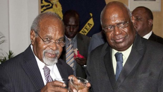 Welcome back &#8230; Somare and Ogio toast the swearing-in of the new Somare cabinet.