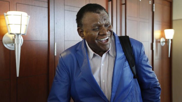 Comedian George Wallace leaves a courtroom in Las Vegas after a jury awarded him $1.3 million.