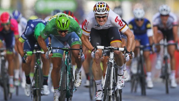 Andre Greipel outsprints Peter Sagan for the stage win in Paris on Sunday.