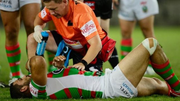 Out: Souths star Greg Inglis was knocked out in the opening minutes of the game against Wests Tigers and spent the rest of the match in the sheds.