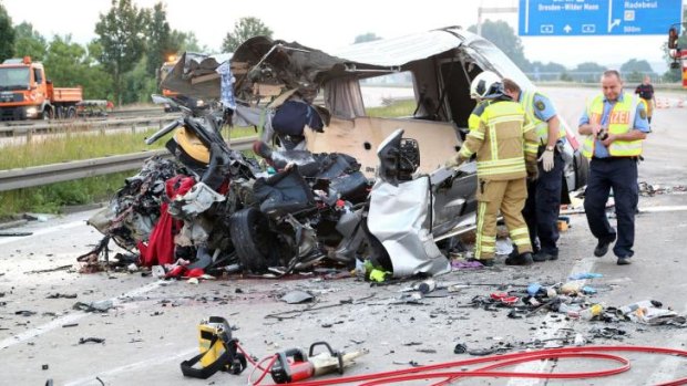 The wreckage of a vehicle at the accident site of a bus crash near the A4 motorway linking Poland and Germany.