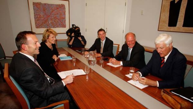 Table manners ... Tony Abbott and Julie Bishop were all smiles as they met the independent MPs, from right,  Bob Katter, Tony Windsor and Rob Oakeshott in Canberra  yesterday.