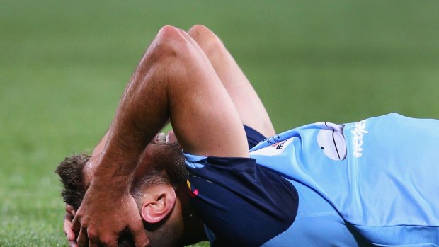 Sydney FC's Michael Zullo feels the pain after being felled by Melbourne City's  Luke Brattan in the FFA Cup final in Melbourne last month.