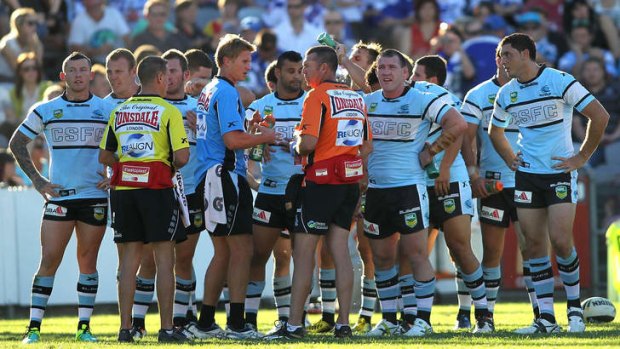 Cronulla players re-group after their fourth consecutive loss to the Bulldogs on Sunday.