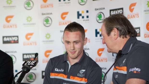 Big move: Tom Scully at the announcement of his switch to GWS with Kevin Sheedy in 2011.