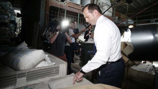 Liberal leader Tony Abbott visits a Brisbane home insulation business.